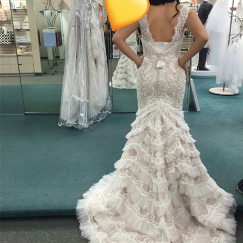David's bridal Beaded lace mermaid
trumpet Galina Signature wedding dress.
